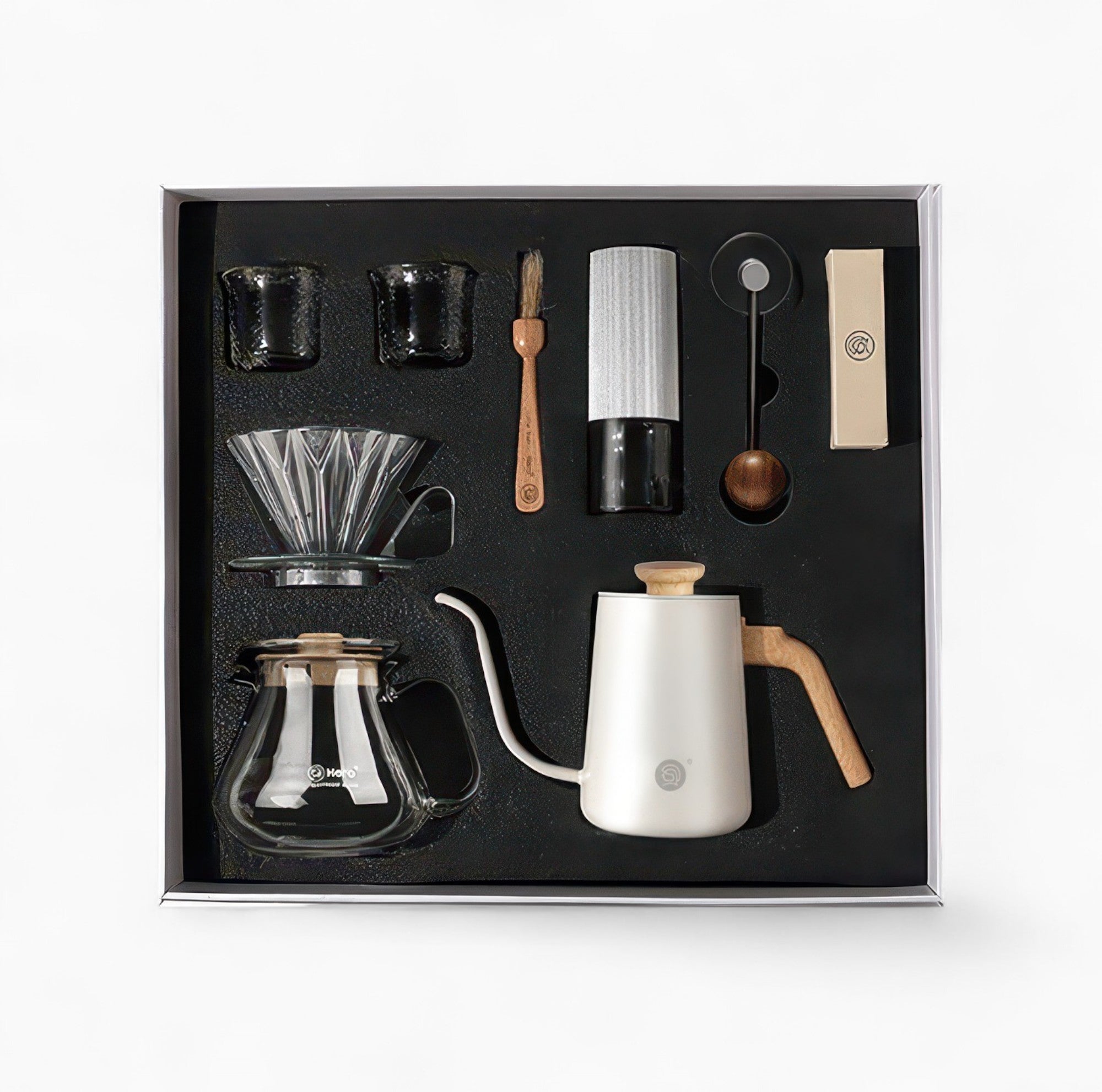 Lastaforest all-in-one pour-over coffee kit with black coffee tools, including a dripper, kettle, and accessories for brewing.