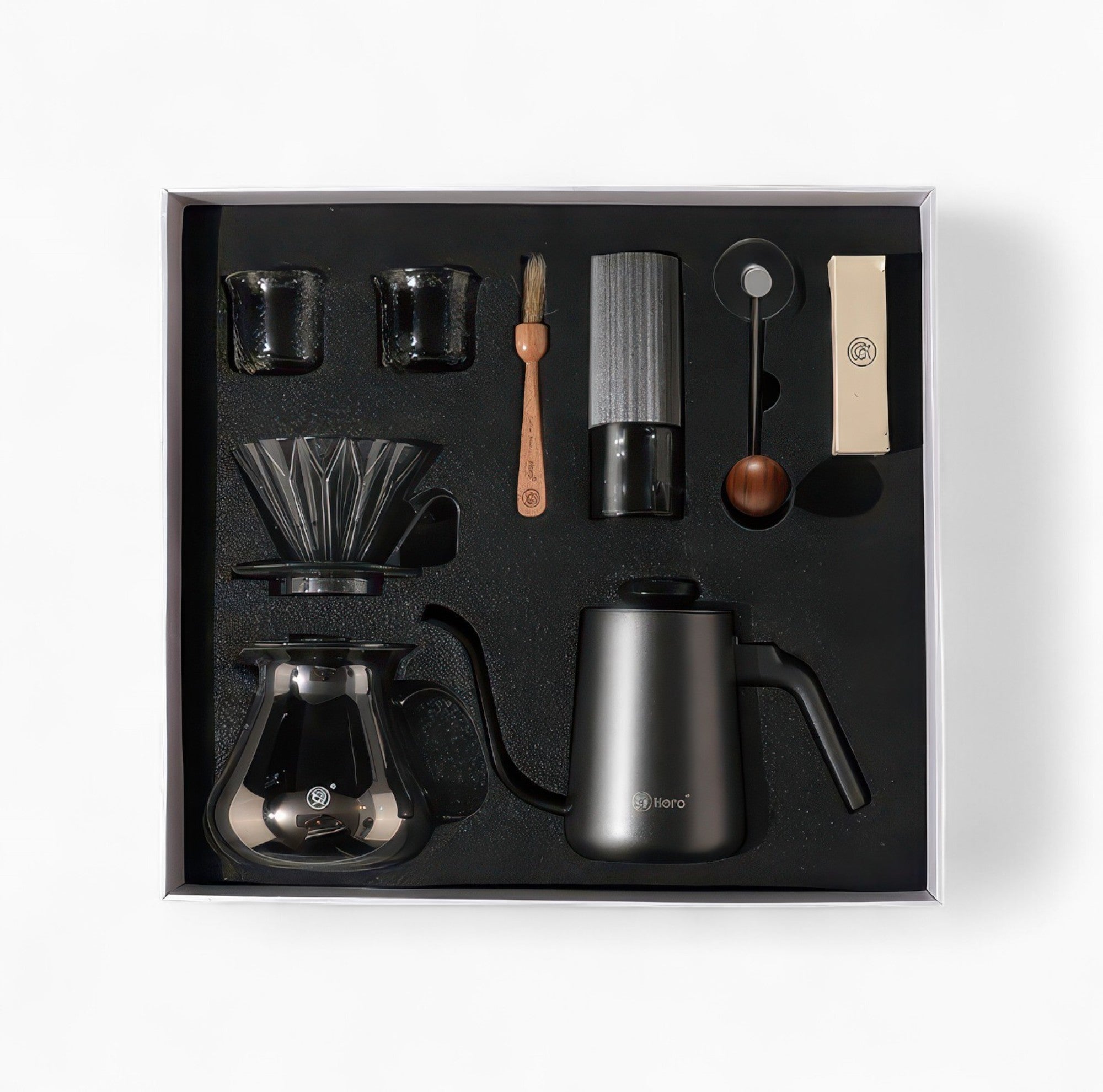 Lastaforest all-in-one pour over coffee kit showing black coffee tools including dripper, server, and accessories in a compact set