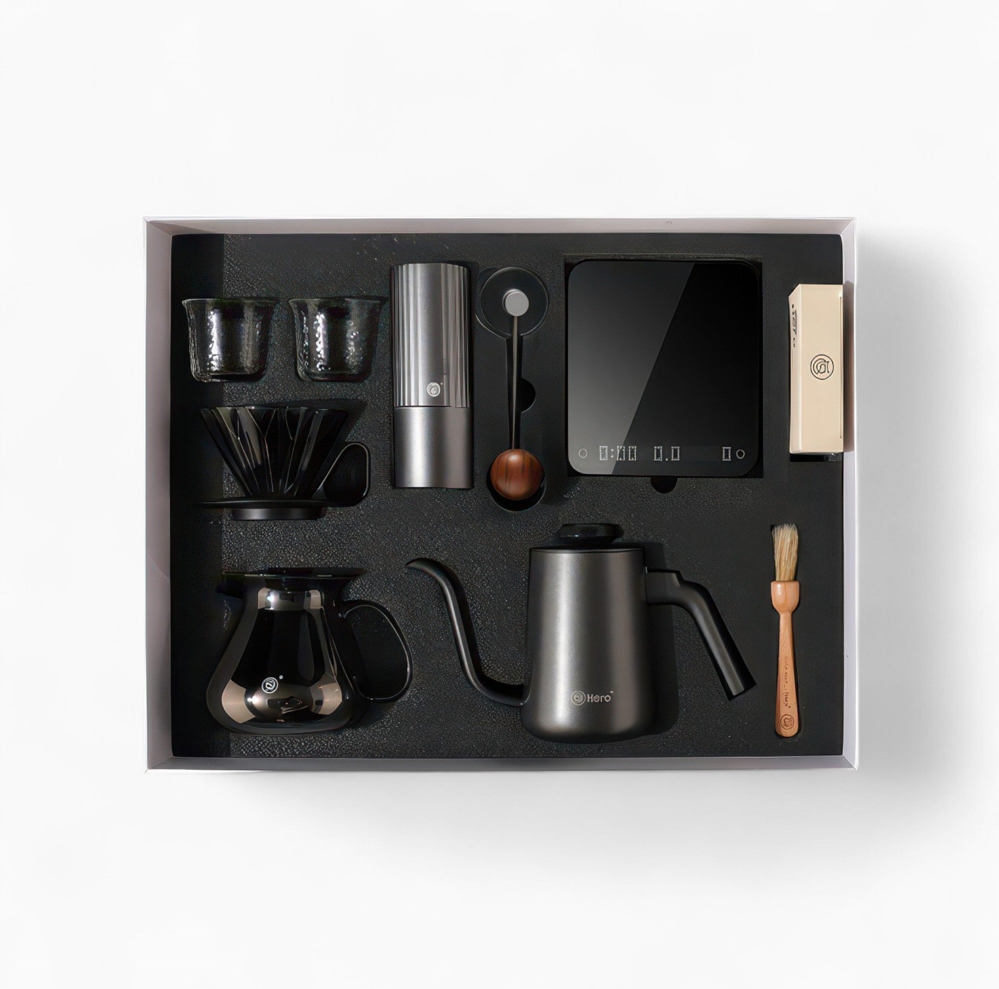 Black All-in-One Pour Over Starter Coffee Kit by Lastaforest with coffee tools including dripper, kettle, and filters.