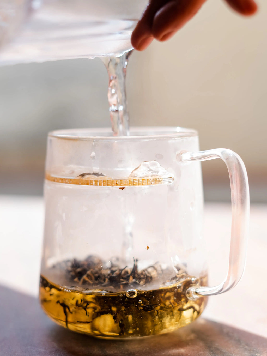 Nepal Tea The WALL® Tea Infuser in stainless steel with mesh basket for brewing loose leaf tea, 440 ml capacity.